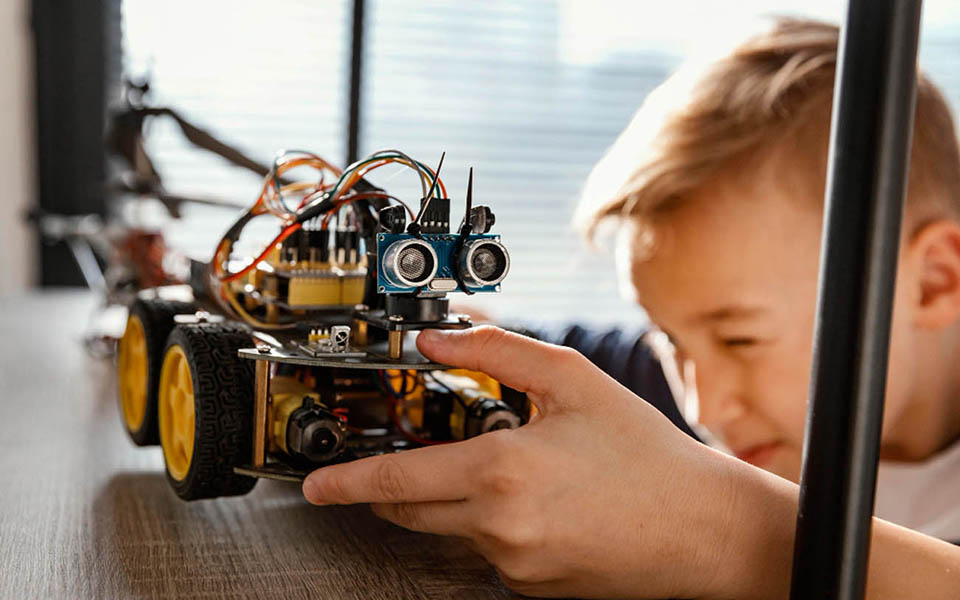 a boy building a robot